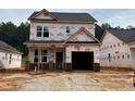 New construction home featuring brick accents and a two-car garage ready for customization at 354 Bluejay St, Clayton, NC 27520