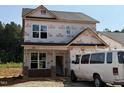 New two-story home with windows, brick accents, and gray roof, ready to be transformed at 354 Bluejay St, Clayton, NC 27520