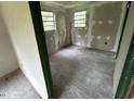 Bright bedroom with multiple windows, offering ample natural light and a serene atmosphere at 3541 Holden Acres Dr, Wendell, NC 27591