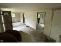 Spacious living room features a large front door, multiple windows, and access to other rooms at 3541 Holden Acres Dr, Wendell, NC 27591