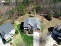 Aerial view of the home showcasing its mature landscaped yard and neighborhood at 3708 Tansley St, Wake Forest, NC 27587