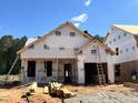 Exterior view of a new home under construction with white siding and visible framework at 378 Bluejay St, Clayton, NC 27520