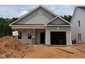 New construction home featuring light gray siding and an attached garage at 378 Bluejay St, Clayton, NC 27520