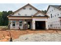 New construction home featuring a garage, framed windows, and covered front porch at 378 Bluejay St, Clayton, NC 27520