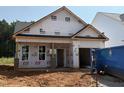 New construction home with unfinished yard and modern design elements ready for personalization at 378 Bluejay St, Clayton, NC 27520