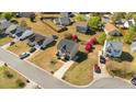 Aerial view of a charming neighborhood showcasing well-maintained homes and landscaped yards at 409 Sapphire Dr, Durham, NC 27703