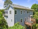 Back of house featuring a wooden deck perfect for entertaining at 445 S Greensboro St, Carrboro, NC 27510