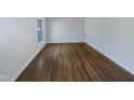 An Empty bedroom with hardwood floors and a window at 4601 Pemberton Dr, Raleigh, NC 27609