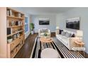 Bright living room with hardwood floors, stylish furniture and decor at 4601 Pemberton Dr, Raleigh, NC 27609