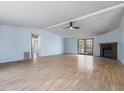 Open living room featuring hardwood floors, fireplace and plenty of natural light at 471 Deer Run, Pittsboro, NC 27312