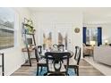 Cozy dining area features a round table and natural light from the patio doors at 501 Campbell Ridge Pl, Wendell, NC 27591
