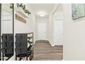 Bright entryway features wood-look flooring and a convenient shoe rack at 501 Campbell Ridge Pl, Wendell, NC 27591