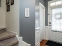 Bright entryway featuring hardwood floors and staircase at 700 Treviso Ln, Apex, NC 27502