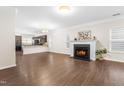 Expansive living area with hardwood floors, recessed lighting, fireplace and easy access to the kitchen at 966 Shoofly Path, Apex, NC 27502