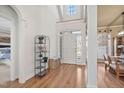 Bright foyer with hardwood floors, a high ceiling and a decorative plant stand at 1217 Wedgeland Dr, Raleigh, NC 27615