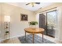 A sunlit dining area offers a wood table, stylish rug, and sliding glass doors at 1245 Schaub Dr, Raleigh, NC 27606
