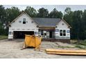 New construction home featuring a spacious layout and a two-car garage, ready for finishing touches and landscaping at 129 Tigris Ct, Zebulon, NC 27597