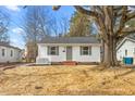 Charming home with white picket fence and a large tree in the front yard at 1409 Ida St, Durham, NC 27705