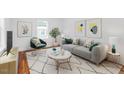 Cozy living room featuring neutral tones, modern furniture, and stylish decor at 1409 Ida St, Durham, NC 27705