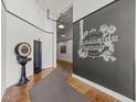 Hallway featuring the historic Caraleigh Mills logo, with a vintage scale and interesting architectural details at 1535 Caraleigh Mills Ct # 105, Raleigh, NC 27603