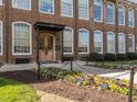 Beautiful brick building with manicured landscaping and colorful flower beds at 1535 Caraleigh Mills Ct # 105, Raleigh, NC 27603
