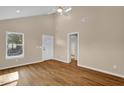 Bright room with vaulted ceiling, stylish flooring, and natural light from a large window at 230 N Melville St, Graham, NC 27253