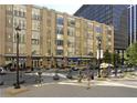 Daytime view of city building with street, parked cars and pedestrians at 319 Fayetteville St # 207, Raleigh, NC 27601