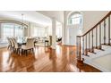 Spacious living room with hardwood floors, open floorplan, and abundant natural light at 4 Teahouse Ct, Durham, NC 27707
