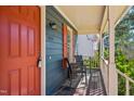 Cozy front porch with seating, offering a relaxing outdoor space with stylish home number sign at 4532 Draper Rd, Raleigh, NC 27616