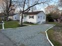 View of the home, driveway, and side yard at 512 Texas Ave, Burlington, NC 27217