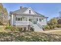 Beautiful home with a spacious front porch, offering a relaxing outdoor space and curb appeal at 523 N Main St, Graham, NC 27253