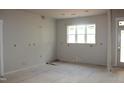 Bright living room with large windows and a view of the backyard at 65 Stream View Way, Spring Hope, NC 27882