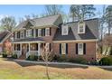 Attractive two-story brick home featuring a well-maintained lawn and traditional architectural details at 706 Oldwyck Dr, Fuquay Varina, NC 27526