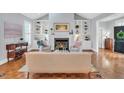 Inviting living room features a fireplace, built-in bookcases, and abundant natural light at 10 E Madison, Pittsboro, NC 27312