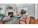 Cozy living room features a fireplace and built-in shelving at 10 E Madison, Pittsboro, NC 27312