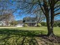 Charming two-story home with a two-car garage, large lawn, and mature landscaping at 10317 Lake Wheeler Rd, Fuquay Varina, NC 27526