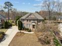 Classic brick home with well-maintained lawn and landscaping, showcasing its inviting curb appeal at 116 Arlen Park Pl, Holly Springs, NC 27540