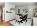 An inviting dining room featuring hardwood floors, stylish decor, and ample space for gatherings at 1403 Copper Cir, Mebane, NC 27302