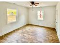 Bedroom with natural light, wood-look flooring, and a ceiling fan at 216 S Tillery St, Rocky Mount, NC 27804