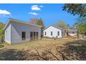 Expansive backyard featuring a well-manicured lawn and a bonus building, perfect for outdoor living at 2330 Glascock St, Raleigh, NC 27610