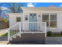 A charming home shows off its inviting front entrance, complete with stylish blue door and modern fixtures at 2330 Glascock St, Raleigh, NC 27610