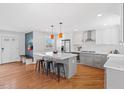 A chef's kitchen with center island, modern appliances, and sleek countertops, designed for culinary excellence at 2330 Glascock St, Raleigh, NC 27610