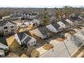 Neighborhood aerial view showcasing well-maintained homes, sidewalks, and green spaces at 2613 Lilymount Dr, Raleigh, NC 27610