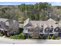 Aerial shot showcasing a well-maintained townhome community with mature trees and green spaces at 3001 Valleystone Dr, Cary, NC 27519