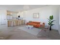 Bright living room features modern furniture and a view of the kitchen at 409 Alston St # 102, Raleigh, NC 27601