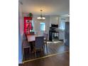 Bright kitchen and dining area with modern appliances and cozy breakfast nook seating at 472 Cedar Ln, Mebane, NC 27302