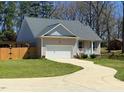 Home exterior with an attached garage and nice yard at 495 Cheves Rd # 495, Zebulon, NC 27597
