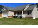 Exterior view of a charming single-Gathering house with a cozy front porch and well-maintained lawn at 495 Cheves Rd # 495, Zebulon, NC 27597