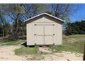 A well-maintained outdoor storage shed with double doors offers additional space for tools and equipment at 5301 Daleview Dr, Raleigh, NC 27610