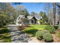 Exterior shot of a well maintained home with driveway and landscaping at 5512 Deer Hunter Ct, Garner, NC 27529